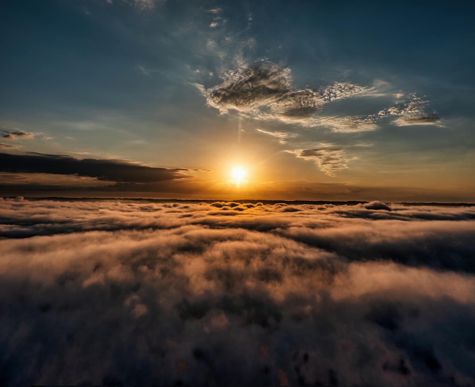 sea of clouds during sunset